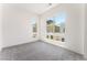 Well-lit bedroom with contemporary design and neutral colored carpet flooring at 647 Spotted Falcon St, Las Vegas, NV 89138