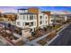 Cordillera townhome complex with modern architecture, manicured landscaping, and inviting entryway features at 647 Spotted Falcon St, Las Vegas, NV 89138