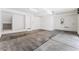 This garage features an electric door, concrete floors and door into the home at 647 Spotted Falcon St, Las Vegas, NV 89138