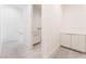 Hallway with carpet and tiled flooring features a small vanity area at 647 Spotted Falcon St, Las Vegas, NV 89138