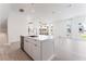 View of open concept kitchen with an island and stainless steel dishwasher and faucet at 647 Spotted Falcon St, Las Vegas, NV 89138