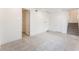 Spacious living area with tile flooring, white walls, and multiple doorways leading to other rooms in the home at 647 Spotted Falcon St, Las Vegas, NV 89138