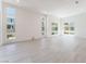 Spacious, bright living room features plenty of natural light and tile flooring at 647 Spotted Falcon St, Las Vegas, NV 89138