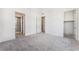 This main bedroom includes plush carpeting, ample closet space, and an ensuite bathroom at 647 Spotted Falcon St, Las Vegas, NV 89138