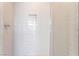 The walk-in shower has subway tile and a built-in niche for storage of bath items at 647 Spotted Falcon St, Las Vegas, NV 89138
