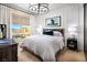 Serene bedroom with a large window, stylish decor, and comfortable bedding creating a relaxing atmosphere at 654 Agate Bridge St, Las Vegas, NV 89138