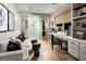 Stylized living space featuring a sofa, built-in desk, and decor at 654 Agate Bridge St, Las Vegas, NV 89138