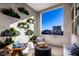 Inviting outdoor patio with comfortable seating, stylish decor, and decorative plants providing a tranquil atmosphere at 654 Agate Bridge St, Las Vegas, NV 89138