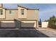 Exterior of a townhome with a paved driveway and attached two-car garage at 6804 Sage Gold Ct, North Las Vegas, NV 89086