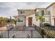 Inviting home exterior with a private, fenced patio and charming curb appeal in a well-maintained community at 6804 Sage Gold Ct, North Las Vegas, NV 89086