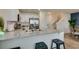 Bright kitchen with granite countertops, stainless steel appliances, and barstool seating for casual dining at 6804 Sage Gold Ct, North Las Vegas, NV 89086