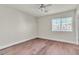 Bedroom with hardwood floors, ceiling fan and a window for natural light at 7632 Calico Fields St, Las Vegas, NV 89149
