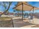 Community pool featuring seating and lounge chairs, offering a relaxing outdoor space at 7632 Calico Fields St, Las Vegas, NV 89149