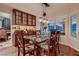 Eat-in kitchen with wood floors, dining table, and decorative built-in shelving at 8396 Garnet Canyon Ln, Las Vegas, NV 89129