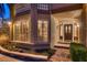 Inviting front entry of a home with manicured landscaping, brick walkway, and decorative windows at 8396 Garnet Canyon Ln, Las Vegas, NV 89129