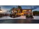 Elegant two-story home with palm trees, three-car garage and a circular driveway at 8396 Garnet Canyon Ln, Las Vegas, NV 89129