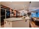 Open kitchen featuring a granite island, stainless appliances, and seamless open floorplan at 8396 Garnet Canyon Ln, Las Vegas, NV 89129