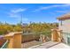 Balcony with a green metal railing offering views of the neighborhood and mountain at 8453 Cheerful Brook Ave, Las Vegas, NV 89143