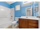 Bathroom with tile flooring and a shower/tub combo, toilet, and vanity at 8453 Cheerful Brook Ave, Las Vegas, NV 89143