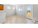 Dining area with tile floors leading to an outdoor balcony offering a scenic view at 8453 Cheerful Brook Ave, Las Vegas, NV 89143