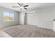 Upstairs carpeted living room with windows and ceiling fan at 8453 Cheerful Brook Ave, Las Vegas, NV 89143