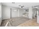 Upstairs living room with carpet, ceiling fan, and banister at 8453 Cheerful Brook Ave, Las Vegas, NV 89143