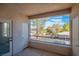 A covered balcony with views of surrounding trees and neighborhood at 913 Duckhorn Ct # 201, Las Vegas, NV 89144