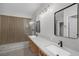 Modern bathroom featuring dual sinks, a large frameless glass shower, and contemporary fixtures at 913 Duckhorn Ct # 201, Las Vegas, NV 89144