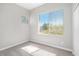 Bright, carpeted room with a large window providing plenty of natural light and views at 913 Duckhorn Ct # 201, Las Vegas, NV 89144