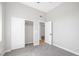 A comfortable bedroom with double sliding-door closet and carpeted floor at 913 Duckhorn Ct # 201, Las Vegas, NV 89144