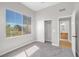 Bright bedroom with a large window and access to an en-suite bathroom through a doorway at 913 Duckhorn Ct # 201, Las Vegas, NV 89144
