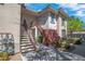 Beautiful home exterior with well-maintained landscaping and entryway stairs at 913 Duckhorn Ct # 201, Las Vegas, NV 89144