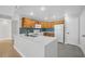 Bright kitchen features stainless appliances, white countertops, wood cabinets, and breakfast bar at 913 Duckhorn Ct # 201, Las Vegas, NV 89144