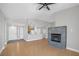 Open concept living room featuring hard wood floors, stone fireplace and lots of natural light at 913 Duckhorn Ct # 201, Las Vegas, NV 89144