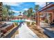 Resort-style community pool features palm trees and poolside lounge chairs at 913 Duckhorn Ct # 201, Las Vegas, NV 89144