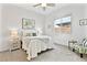 Comfortable bedroom with a soft bed, nightstand, stylish chair, and bright window for natural lighting at 916 Belleforte Ln, Las Vegas, NV 89138