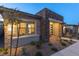 Inviting front yard featuring desert landscaping and a stone accent wall at 916 Belleforte Ln, Las Vegas, NV 89138