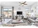 Inviting living room featuring neutral furniture, modern decor, and backyard access at 916 Belleforte Ln, Las Vegas, NV 89138
