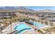Community pool area with comfortable seating and mountain views at 916 Belleforte Ln, Las Vegas, NV 89138