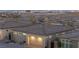 Aerial view of a modern home featuring an attached two car garage and neighborhood views at 916 Belleforte Ln, Las Vegas, NV 89138