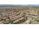 Expansive aerial view of a residential area with lush greenery and well-maintained homes under a clear sky at 9513 Yucca Blossom Dr, Las Vegas, NV 89134