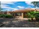 Charming backyard with desert landscaping, covered patio and multiple windows for ample light at 9513 Yucca Blossom Dr, Las Vegas, NV 89134
