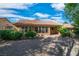 Charming backyard with desert landscaping, covered patio and multiple windows for ample light at 9513 Yucca Blossom Dr, Las Vegas, NV 89134