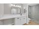 Updated bathroom with modern vanity, framed mirror, and glass-enclosed tiled shower at 9513 Yucca Blossom Dr, Las Vegas, NV 89134