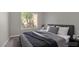 Comfortable bedroom with a plush bed, modern decor, and plenty of natural light at 9513 Yucca Blossom Dr, Las Vegas, NV 89134