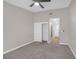 Bedroom featuring plush carpet, a ceiling fan, and closet space at 9513 Yucca Blossom Dr, Las Vegas, NV 89134