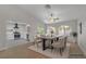 Bright dining room with modern table, chairs and neutral decor with a view to the yard at 9513 Yucca Blossom Dr, Las Vegas, NV 89134