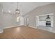 Open living area with hardwood floors, modern lighting, and access to the updated kitchen at 9513 Yucca Blossom Dr, Las Vegas, NV 89134