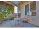 Charming back patio with seating, surrounded by stone landscaping and lush vines at 953 Wagner Valley St, Henderson, NV 89052