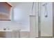 Bright bathroom featuring a separate tub and shower, with wood blinds and neutral decor at 953 Wagner Valley St, Henderson, NV 89052